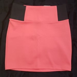 Coral and black mini skirt